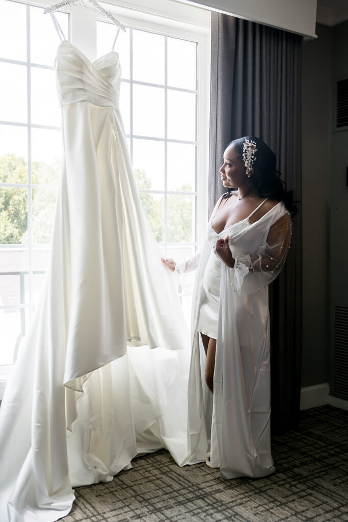 Elopement at Chateau Elan Winery Bride with wedding dress in window, captured by JAM&CO Studios Atlanta elopement Photographer