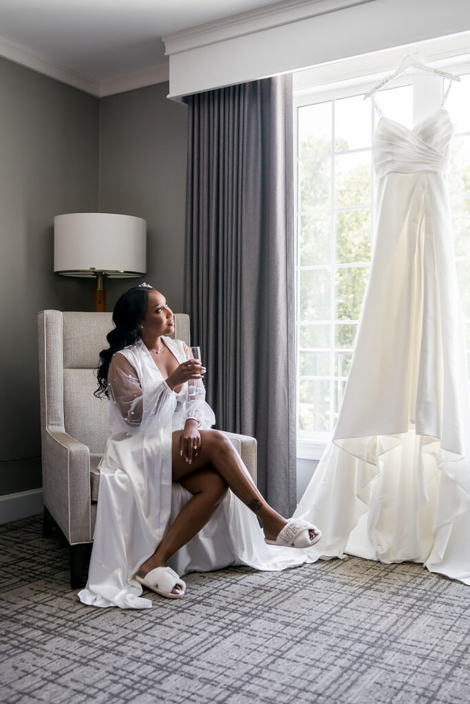 Elopement at Chateau Elan Winery captured by JAM&CO Studios Atlanta Elopement photographer Bride looking at dress in window