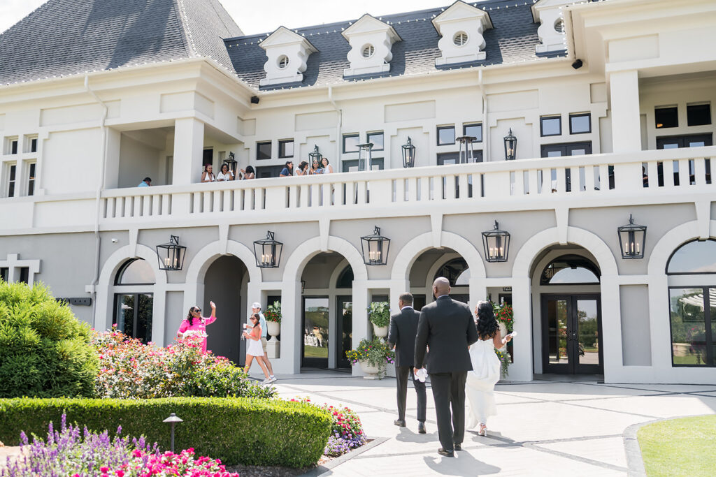 Elopement at Chateau Elan Winery captured by JAM&CO Studios Atlanta Elopement photographer bride and groom walking towards venue
