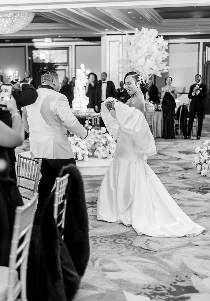 The Whitley Hotel Wedding captured by JAM&CO Studios wedding photo and video team bride and groom enter wedding reception