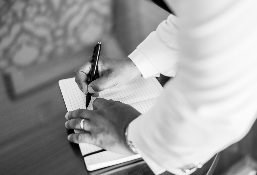 The Whitley Hotel Wedding captured by JAM&CO Studios wedding photo and video team groom writing letter to bride