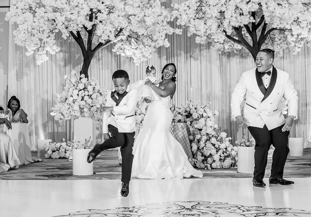 The Whitley Hotel Wedding captured by JAM&CO Studios wedding photo and video team black and white photo of brides son dancing