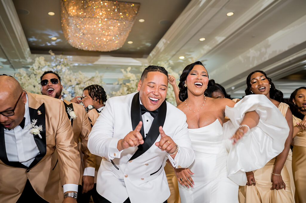 The Whitley Hotel Wedding captured by JAM&CO Studios wedding photo and video team bride and groom dancing with bridal party
