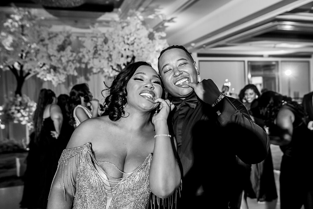 The Whitley Hotel Wedding captured by JAM&CO Studios wedding photo and video team bride and groom showing their gold mouth grills