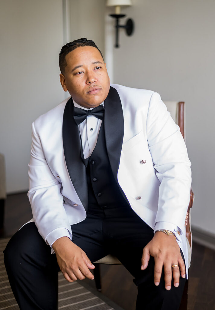 The Whitley Hotel Wedding captured by JAM&CO Studios wedding photo and video team Groom portrait in chair