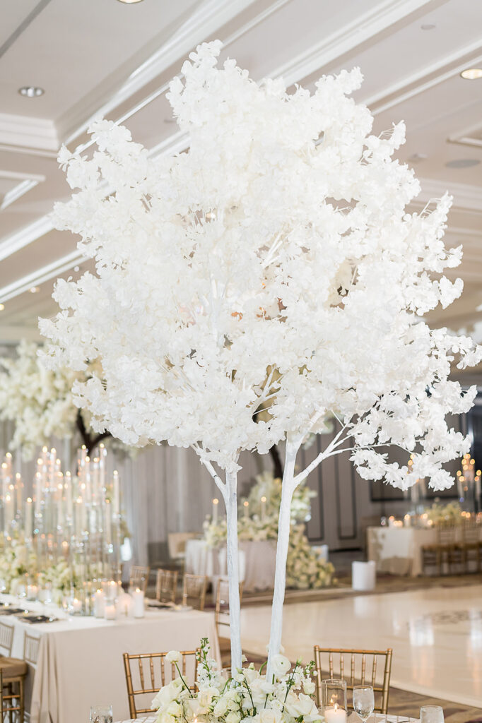 The Whitley Hotel Wedding captured by JAM&CO Studios wedding photo and video team table tree decor by Sejour events