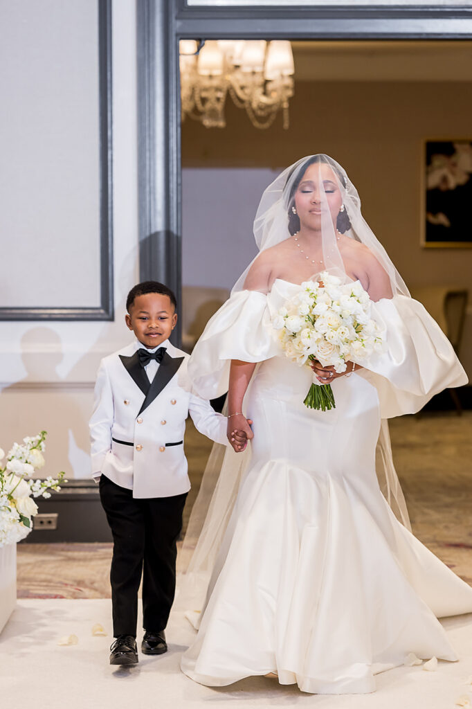 The Whitley Hotel Wedding captured by JAM&CO Studios wedding photo and video team Son walking mom down the aisle 